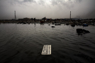 A keyboard lies in a polluted lagoon at Agbogbloshie dump, which has become a dumping ground for computers and electronic waste from all over the developed world. Hundreds of tons of e-waste end up he...