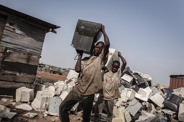 Computer monitors are broken apart to salvage metal and circuit boards at Agbogbloshie dump, which has become a dumping ground for computers and electronic waste from all over the developed world. Hun...