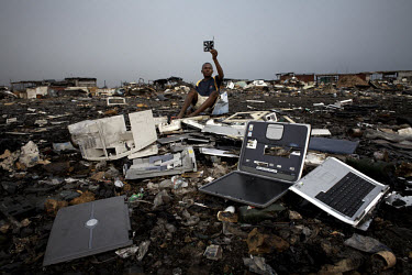 Discarded laptops lie on the ground at Agbogbloshie dump, which has become a dumping ground for computers and electronic waste from all over the developed world. Hundreds of tons of e-waste end up her...