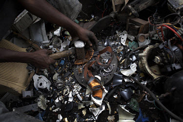 Copper is retrieved from a computer monitor at Agbogbloshie dump, which has become a dumping ground for computers and electronic waste from all over the developed world. Hundreds of tons of e-waste en...