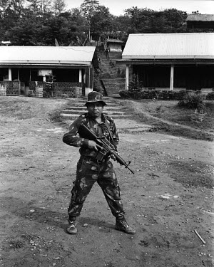 38 year commandant of the Mibang camp, Major Dara Singh poses for a portrait with an M16 assault rifle at the Basabari camp of the Dimasa militant group, Dima Halim Daogah (Jewel faction), also known...