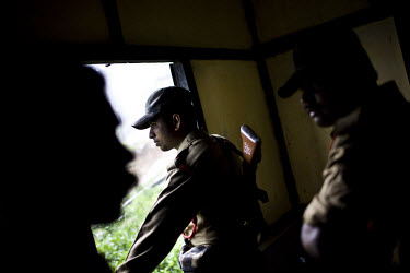 Security forces watch over the Dimasa community centre in Jorai village. On the 8th of May 2009, suspected Zeme Naga militants burnt down 10 of the 13 houses in the Dimasa village of Jorai, sparing th...