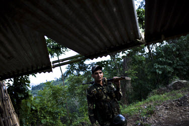 A soldier from the Central Reserve Police Force (CRPF) patrols the outskirts of Haflong city. Recent ethnic clashes between the Dimasa and Zeme Naga tribals have left scores of people dead and tens of...