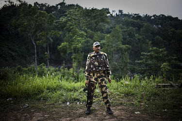 A senior soldier from the Central Reserve Police Force (CRPF) patrols the outskirts of Haflong city. Recent ethnic clashes between the Dimasa and Zeme Naga tribals have left scores of people dead and...