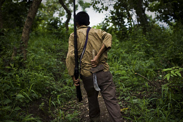 43 year old Damtuing, a Zeme Naga from Mabauram village, patrols the village with his ancient hunting rifle and machete. Like many Zeme Nagas, he has been forced to take shelter in the lower part of t...