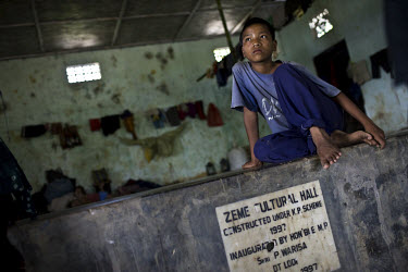 12 year old Ihungbe Rinbe, whose house was torched by suspected Dimasa militants, shelters in Zeme cultural hall in Lodi village in Upper Haflong. Recent ethnic clashes between the Dimasa and Zeme Nag...