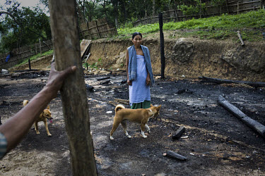 Joiso Longmalai stands on the spot where her house once stood. On the 8th of May 2009, suspected Zeme Naga militants burnt down 10 of the 13 houses in the Dimasa village of Jorai, sparing the school a...