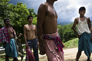 Dimasa men in Jorai village. On the 8th of May 2009, suspected Zeme Naga militants burnt down 10 of the 13 houses in the village, sparing the school and community centre where many families were takin...