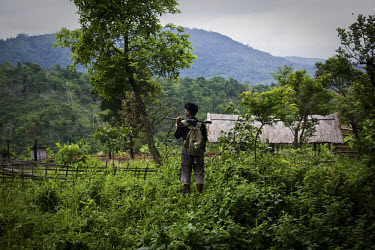 A villager from Mabauram village keeps a look out over the area. Like many Zeme Nagas, he has been forced to take shelter in the lower part of the village, after suspected Dimasa militants killed two...