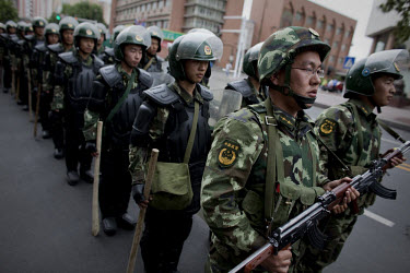 Security forces patrol following unrest after Friday prayers in Urumqi. Due to the recent ethnic violence, Chinese authorities had tried to stop Friday prayers going ahead but at the last minute the d...