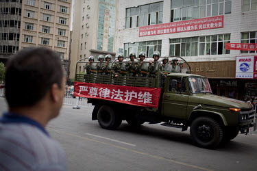 Security forces patrol following unrest after Friday prayers in Urumqi. Due to the recent ethnic violence, Chinese authorities had tried to stop Friday prayers going ahead but at the last minute the d...