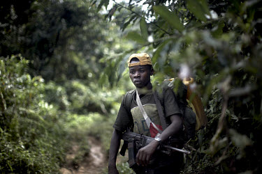 A young FDLR (Democratic Forces for the Liberation of Rwanda) soldier in the jungles of North Kivu. The FDLR comprises Hutu extremists who fled Rwanda after their involvement in the 1994 genocide, as...