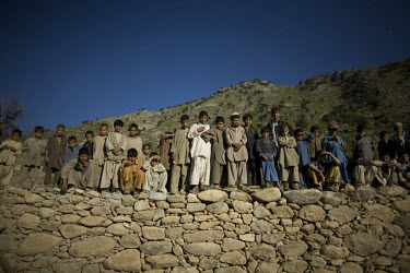 Children wait while elders handout humanitarian aid donated from Delta-4, 1-26 Infantry via the Afghan National Army in Shilam in the Pesh Valley. Delta-4, 1-26 Infantry visited elders in the village...