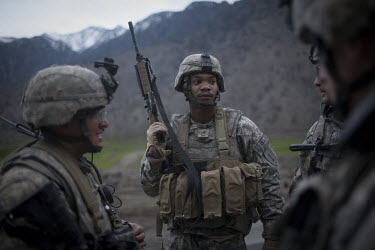 US Army soldiers from the HHT Unit of the 3rd Brigade Combat Team, 1st Infantry Division secure the site of a roadside bomb near Nishigham village. The HHT Unit of the 3rd Brigade Combat Team, 1st Inf...