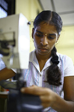 A young woman, whose parents work at the tea plantations, works at the shoe factory of Hunugala Shoe Industries in Elkaduwa. She took part in a training scheme put together by the International Fund f...