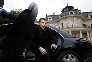 Mikhail Prokhorov, Russia's richest man in 2009, gets out of his Maybach car at his country residence outside Moscow. Prokorov made his fortune in investments. In 2009 his estimated net worth was $9.5...