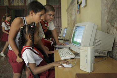 A computer class at a middle school in central Havana. Computers are starting to become available in some Cuban schools - especially in Havana. These students are practicing word processing and other...
