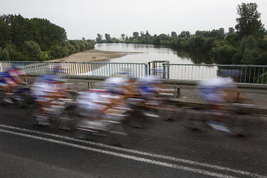 The Tour De Pologne bicycle race crosses a bridge over the Wislok River.