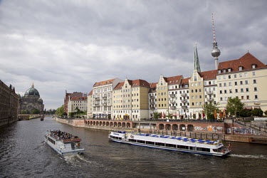 The River Spree flows past the Nikolai quarter of former East Berlin - restored in the 1980s by the East German government for the city's 750th anniversary. Before the Wall came down it was the most s...