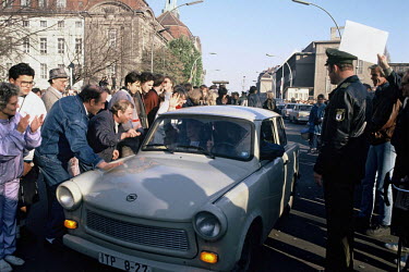 East Germans are welcomed as they drive their Trabant into West Berlin, on the morning of November 10, 1989, hours after the opening of the Berlin Wall.
