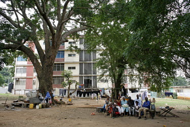 Homeless refugees from DR Congo and Sudan living out in the open under trees in a residential neighbourhood of Accra.