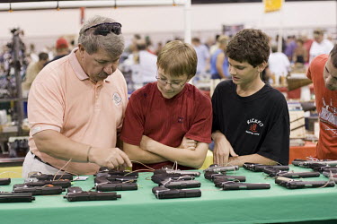 Potential owners browse at a gun show in West Palm Beach, Florida which sells all types of guns. Florida has some of the most permissive gun ownership laws in the USA.