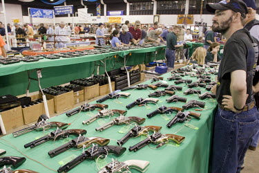 A potential owner browses at a gun show in West Palm Beach, Florida which sells all types of guns. Florida has some of the most permissive gun ownership laws in the USA.