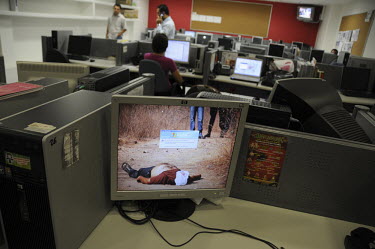 Offices of newspaper 'El Debate' with a photo of a crime scene as the screen saver on a computer. Culiacan is the state capital of Sinaloa, home base of the feared Sinaloa drugs cartel that is involve...