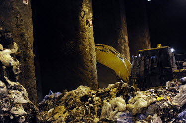 The loading bay at Covanta Waste-to-Energy plant, Westbury, New York. The plant feeds rubbish into giant furnaces that produce steam to turn a turbine and produce electricity.