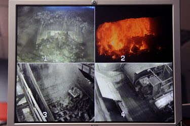 CCTV monitors all parts of the process at Covanta Waste-to-Energy plant, Westbury, New York. The plant feeds rubbish into giant furnaces that produce steam to turn a turbine and produce electricity.