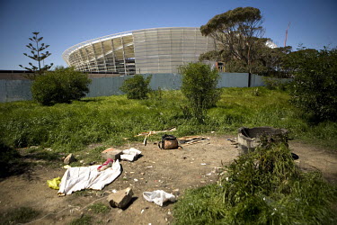 The remains of a homeless camp in the shadow of Green Point Stadium. This area is used by a small group of homeless people to cook and socialise. The stadium is one of 10 stadia in South Africa that w...