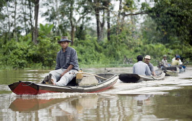Fishermen in a boat on the Cenaku River.