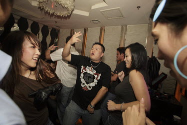 A birthday party held in a private room at Vics, a nightclub frequented by young affluent Chinese.