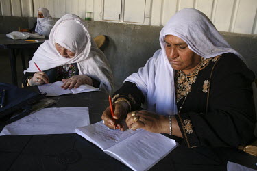Bedouin women in an adult literacy class in the unrecognised Bedouin village of Al Zarnock in the Negev desert. Around 75,000 Bedouin people who live in this region are in unrecognised villages. The v...