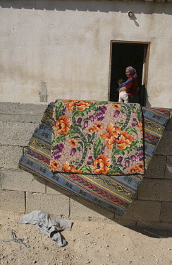 Carpets are given an airing in the unrecognised Bedouin village of Al Zarnock in the Negev desert. Around 75,000 Bedouin people who live in this region are in unrecognised villages. The villages are n...