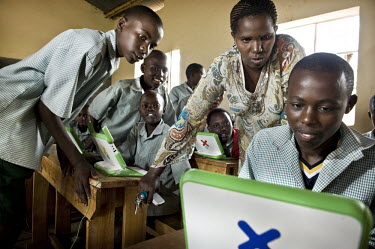 Children practice their computer skills on new robust laptops. Rwanda is one of the first African countries to be part of the One Laptop per Child (OLPC) project, which seeks "to create educational op...