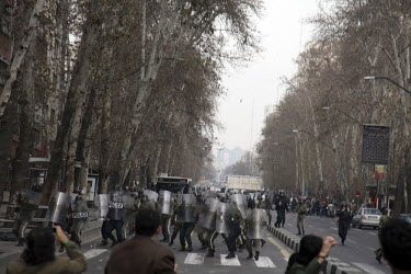 Protesters clash with security forces on Valiasr Street in central Tehran. Following the massive post-election prostests held by opposition groups during the summer of 2009, another series of protests...
