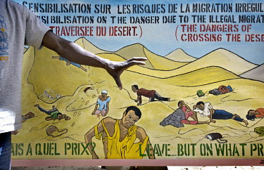 In a migrants' shelter in Gao, a mural depicts the dangers of travelling through the desert.