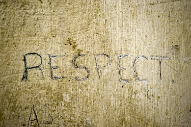 The word�Respect scratched into the wall in a so called safe house in Rabat - a house where illegal migrants stay until they have enough resources for the next stage of their journey towards Europe.