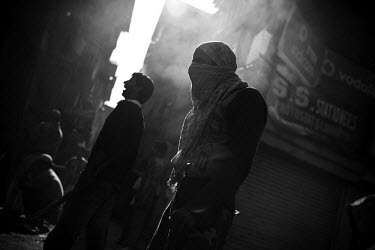 Protestors throw rocks and shout slogans at the police in the old city of Srinagar. The protests were part of a five day strike, called after two young women were raped and killed in the town of Shopi...