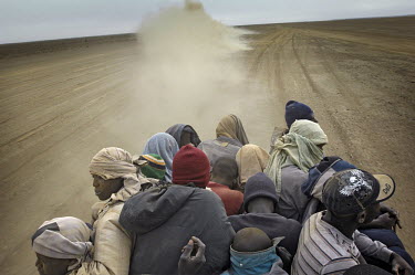 Migrants on their way through the desert towards the border with Algeria, to try to get to Europe in search of a better life.