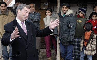 Nigel Farage, then leader of the UK Independence Party (UKIP), meets with members of the Roma community in Boldesti Scaieni in advance of Romania joining the European Union (EU). UKIP campaigns for Br...