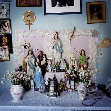 A Candomble altar in the house of Mai Filinha, the Perpetual Judge (eldest member) of the Irmandade da Boa Morte (Sisterhood of the Good Death). The Sisterhood began as a bank in 1823, founded by free...