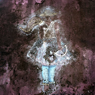 A faded mural of Oxissa - the god (orixa) of the hunters in the Candomble religion.