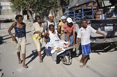 Wounded people are brought to makeshift hospitals four days after the earthquake hit Port-au-Prince. There is hardly any medical care in the city as most hospitals have collapsed.A 7.0 magnitude earth...