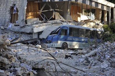 A crushed school bus amid the devastation in the streets of Port-au-Prince six days after an earthquake hit the city.A 7.0 magnitude earthquake struck Haiti on 12/01/2010. Early reports indicated that...