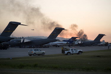 C-17 planes from the US Air Force and other transport planes on the tarmac at Port-au-Prince airport five days after an earthquake hit the city. The airport has only one runway, which caused logistica...