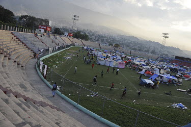 A large number of people who have lost their homes have set up tents on the pitch of the football stadium of Port-au-Prince, one week after an earthquake hit the country. A 7.0 magnitude earthquake st...