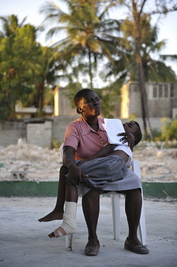 At a field hospital run by the NGO Merlin, a worried mother holds her sleeping son, who was injured when an earthquake hit the country. A 7.0 magnitude earthquake struck Haiti on 12/01/2010. Early rep...