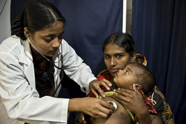 A mother and child at a health clinic run by the Patuakhali Development Centre.